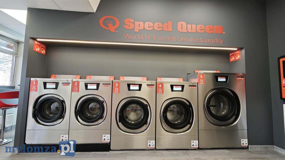 Laundry interior with Speed Queen washers and dryers.